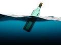 Empty green glass bottle in the sea Royalty Free Stock Photo