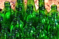 Empty green glass bottles, glass recycling concept background Royalty Free Stock Photo