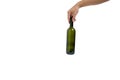 Empty, green, glass wine bottle in hand on a white background, isolate Royalty Free Stock Photo