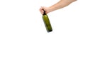 Empty, green, glass wine bottle in hand on a white background, isolate Royalty Free Stock Photo