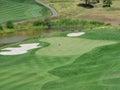 Empty Green On Golf Course With Sand Traps And Pond Royalty Free Stock Photo