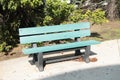 empty green gray solo single wood wooden bench park outside on pavement cement 167 p 17