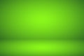 Empty green studio abstract background with spotlight effect. Product showcase backdrop. Chroma key compositing.