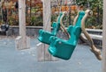 Empty green swings Royalty Free Stock Photo