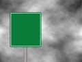 An empty green traffic sign against a dark, cloudy and thunderous sky. sign for your text space and message. Ve Royalty Free Stock Photo