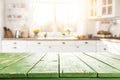 Empty Green Wooden Table with Bright White Interior of the Kitchen Royalty Free Stock Photo