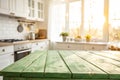 Empty Green Wooden Table with Bright White Interior of the Kitchen Royalty Free Stock Photo