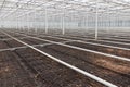 Empty greenhouse with soil prepared for cultivation of plants Royalty Free Stock Photo