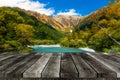 Empty grey wooden table or wooden terrace with beautiful view of Kamikochi National Park