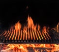 Empty grill grate and tongues of fire flame. Barbeque night background Royalty Free Stock Photo