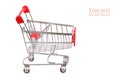 Empty grocery shopping cart. Miniature empty red color shopping cart or trolley isolated on white background. There is some free Royalty Free Stock Photo