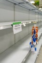 Empty grocery store shelves at Publix fully out of stock of all supplies including toilet paper, paper products, and bathroom