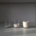 Empty,half and full milk glasses. Dairy products