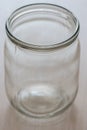Empty half-liter glass jar on the table closeup