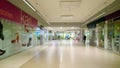 Empty hall of largest modern shopping and entertainment mall after coronavirus pandemic. Shops closed. Decrease in consumer demand Royalty Free Stock Photo