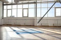 empty hall without people in the morning with sunlight, two yoga mats lie on the floor in the sports room