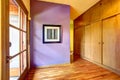 Empty hallway with bright purple wall