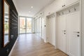 Empty hallway with white doors and black wall in modern apartment Royalty Free Stock Photo