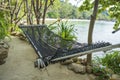 Empty hammock on beautiful tropical beach near sea water, Thailand, close up Royalty Free Stock Photo