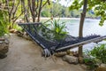 Empty hammock on beautiful tropical beach near sea water, Thailand, close up Royalty Free Stock Photo