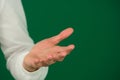 Empty hand palm up gesture isolated man guy on a green background chromakey close-up dark hair young man. white