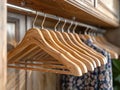 empty hangers and shirts of different colors hanging in the wardrobe