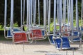 Empty hanging seats for children on the carousel Royalty Free Stock Photo