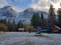 Empty helicopter waiting under the snowy mountain in scenic British Columbia.