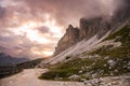 Empty high mountain path under dramatic sky at sunset Royalty Free Stock Photo