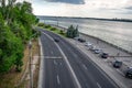 Empty highway along the banks of the Dnieper river in Dnipro Ukraine - top view. Cityscape with cars parked on Sicheslavskaya