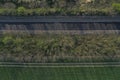 Empty highway, asphalt road texture. Green summer bushes and field. Royalty Free Stock Photo