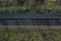 Empty highway, asphalt road texture. Green summer bushes and field. Royalty Free Stock Photo