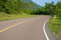 Empty highway in green summer landscape. Straight road in wild forest. Summer outdoor travel landscape.