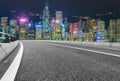 Empty highway and Hong Kong victoria skyline at night Royalty Free Stock Photo