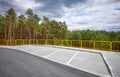 Empty highway rest area by a forest Royalty Free Stock Photo