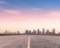 an empty highway road to the city in the early morning. Royalty Free Stock Photo