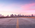 an empty highway road to the city in the early morning. Royalty Free Stock Photo