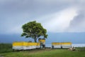 Empty Hindu Bali Temple on Lakeside After Religious Ceremonial Offering with Sunlight From Misty Morning Cloudy Sky Shinning on it Royalty Free Stock Photo