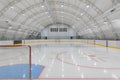 empty hockey field, arena with ice and markings and gates