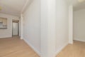 Empty home with hallways with light oak floorboards
