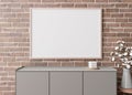 Empty horizontal picture frame on brown brick wall in modern living room. Mock up interior in minimalist, contemporary Royalty Free Stock Photo
