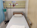 An empty hospital bed. It is in a state of readiness to accept patients. Royalty Free Stock Photo