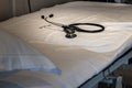 Empty hospital bed with a stethoscope, loneliness, solitude, coronavirus pandemia crisis