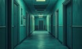 Empty hospital corridor with teal walls and closed doors creating eerie atmosphere Royalty Free Stock Photo