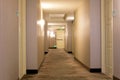 Empty hotel hall with emergency exit in the distance