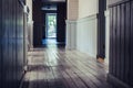 Empty Hotel Hallway with Wooden Board Floor - Daylight Shining Through Windows, Concept of Post Apocalypse Royalty Free Stock Photo
