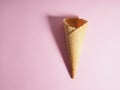 Empty ice cream waffle cup, cone cone on pink background Royalty Free Stock Photo
