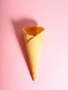 Empty ice cream waffle cup, cone cone on pink background Royalty Free Stock Photo