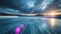 Empty ice rink reflecting dramatic sunset light Royalty Free Stock Photo