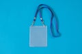 Empty ID card badge icon with blue belt, on blue background. Royalty Free Stock Photo